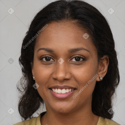 Joyful black young-adult female with long  brown hair and brown eyes