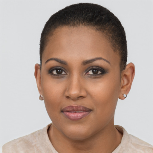 Joyful black young-adult female with short  brown hair and brown eyes