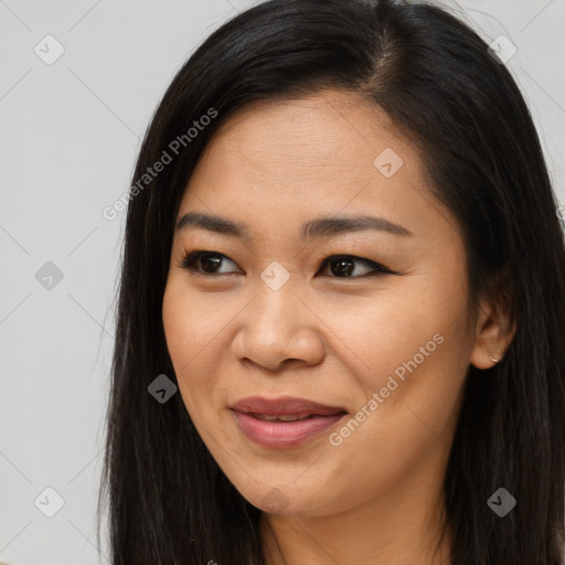 Joyful asian young-adult female with long  brown hair and brown eyes