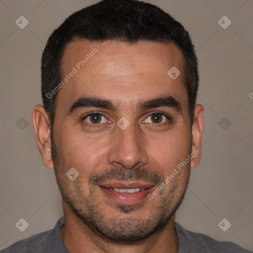 Joyful white adult male with short  brown hair and brown eyes