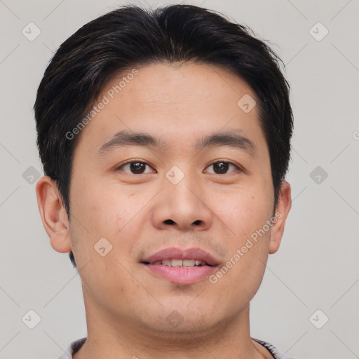 Joyful asian young-adult male with short  brown hair and brown eyes