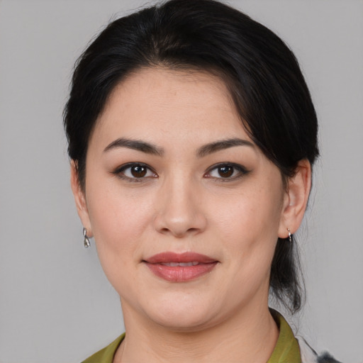 Joyful white young-adult female with medium  black hair and brown eyes