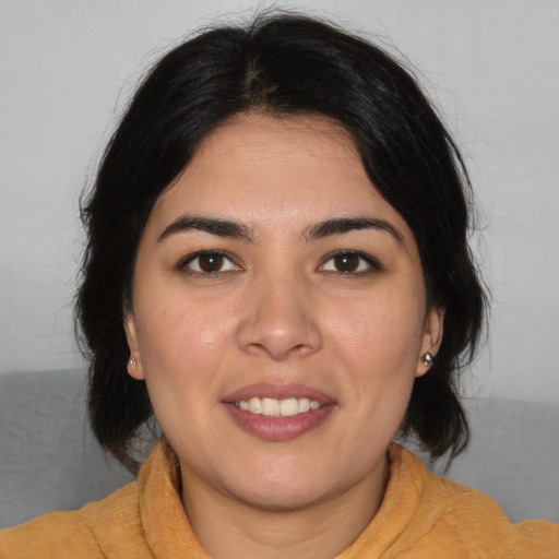 Joyful asian young-adult female with medium  brown hair and brown eyes