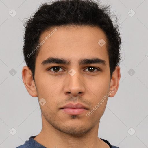 Neutral latino young-adult male with short  brown hair and brown eyes