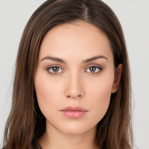 Neutral white young-adult female with long  brown hair and brown eyes