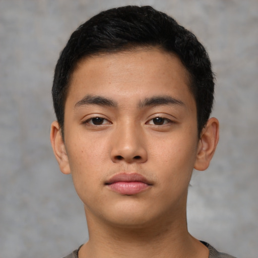 Neutral asian young-adult male with short  brown hair and brown eyes