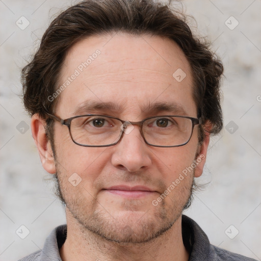 Joyful white adult male with short  brown hair and grey eyes