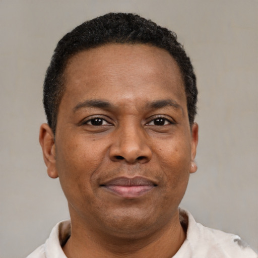 Neutral latino adult male with short  brown hair and brown eyes