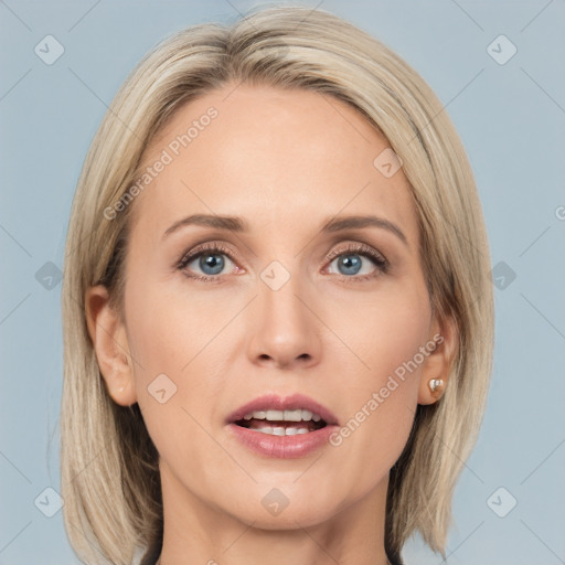 Joyful white adult female with medium  brown hair and blue eyes