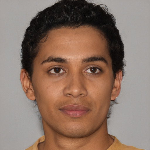Neutral latino young-adult male with short  brown hair and brown eyes