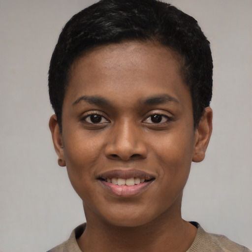 Joyful black young-adult female with short  black hair and brown eyes
