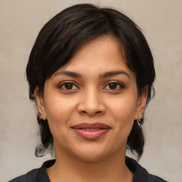 Joyful white young-adult female with medium  brown hair and brown eyes