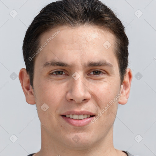 Joyful white adult male with short  brown hair and brown eyes