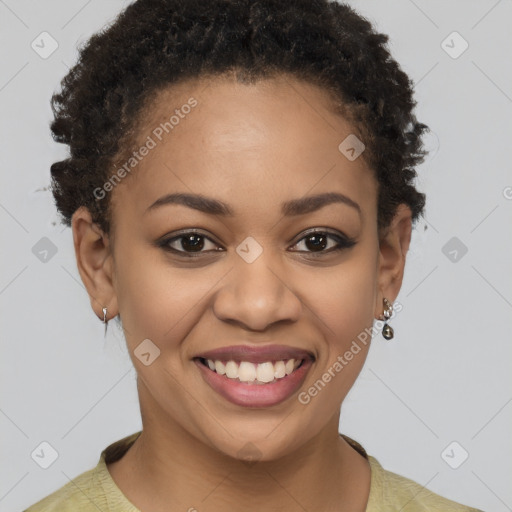 Joyful black young-adult female with short  brown hair and brown eyes