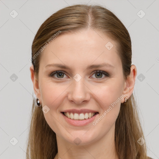 Joyful white young-adult female with long  brown hair and grey eyes