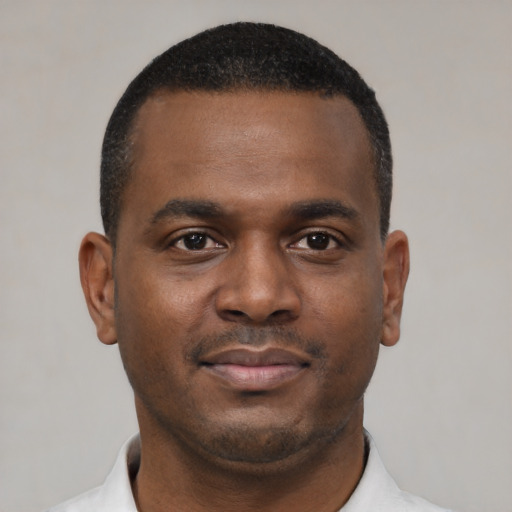 Neutral black young-adult male with short  brown hair and brown eyes