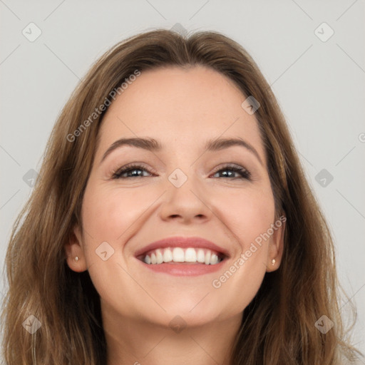 Joyful white young-adult female with long  brown hair and grey eyes