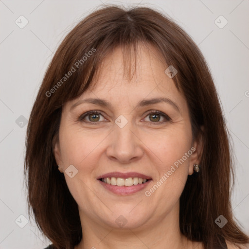 Joyful white adult female with medium  brown hair and grey eyes