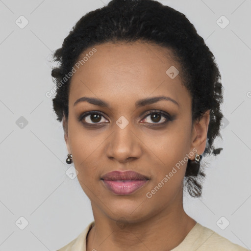 Joyful black young-adult female with short  black hair and brown eyes