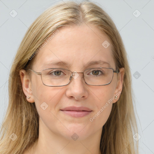 Joyful white adult female with long  brown hair and blue eyes