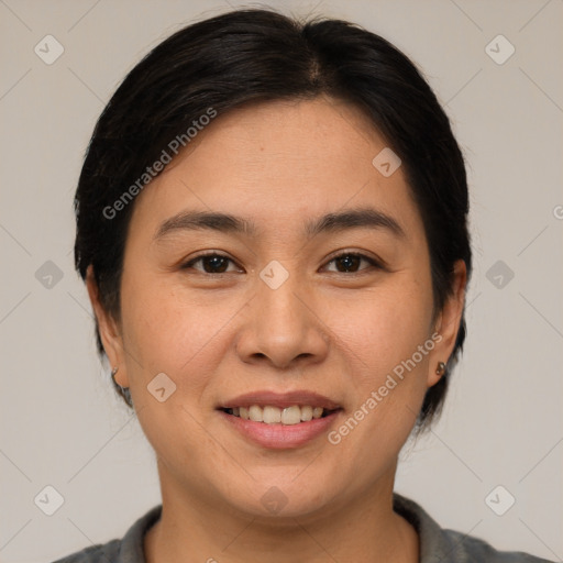 Joyful asian young-adult female with short  brown hair and brown eyes