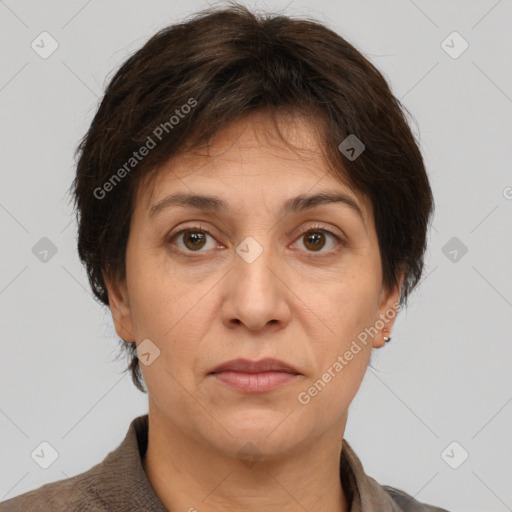 Joyful white adult female with short  brown hair and brown eyes