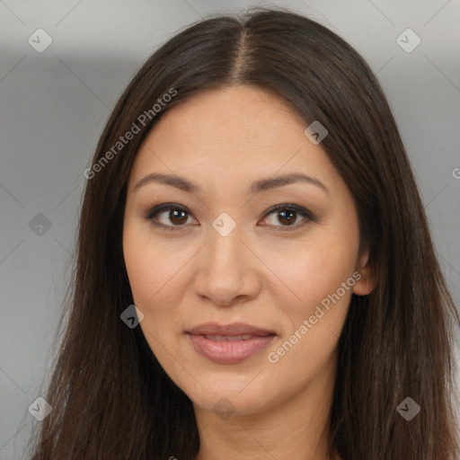 Joyful asian young-adult female with long  brown hair and brown eyes