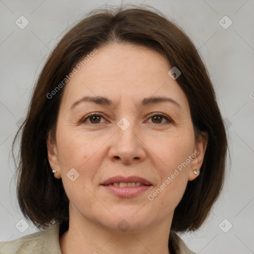 Joyful white adult female with medium  brown hair and brown eyes