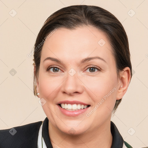 Joyful white young-adult female with medium  brown hair and brown eyes