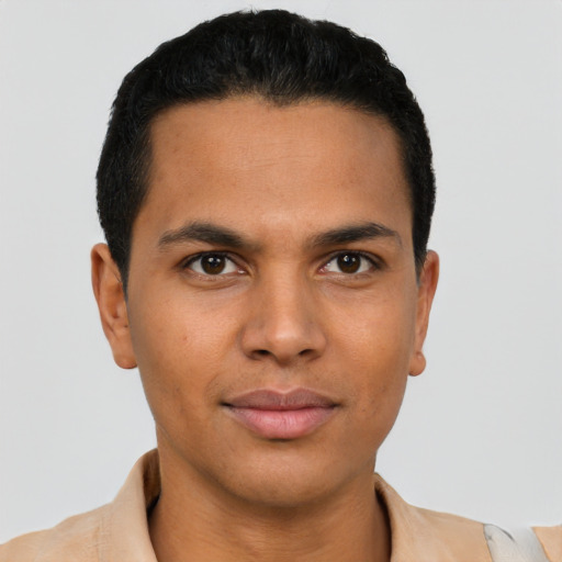 Joyful latino young-adult male with short  black hair and brown eyes