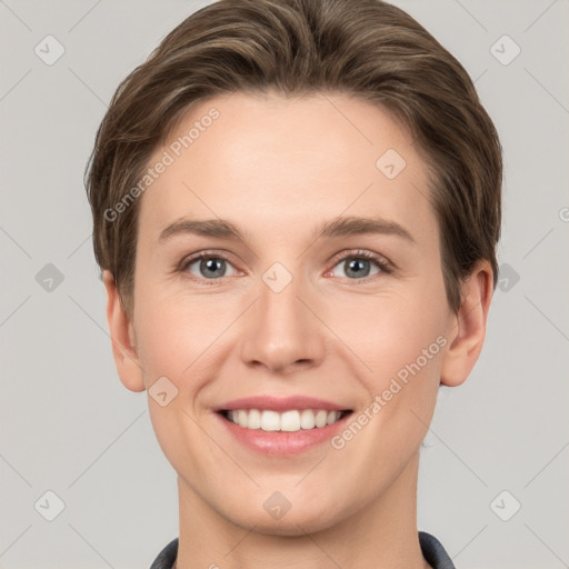 Joyful white young-adult female with short  brown hair and grey eyes