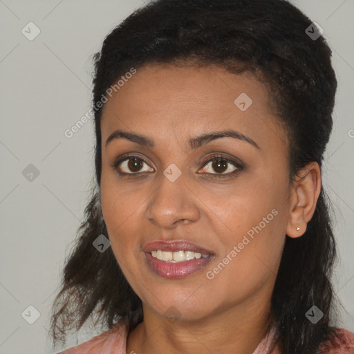 Joyful black young-adult female with medium  brown hair and brown eyes