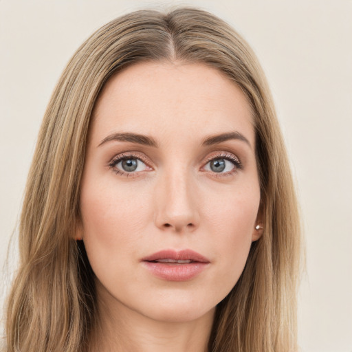 Neutral white young-adult female with long  brown hair and green eyes