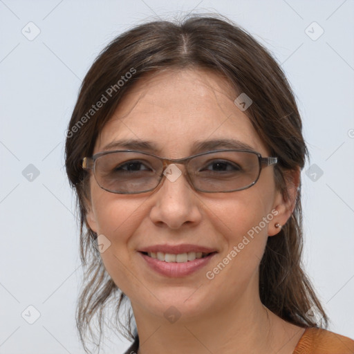 Joyful white adult female with medium  brown hair and brown eyes