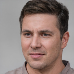 Joyful white adult male with short  brown hair and brown eyes