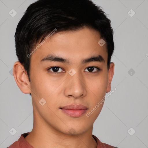 Joyful asian young-adult male with short  brown hair and brown eyes