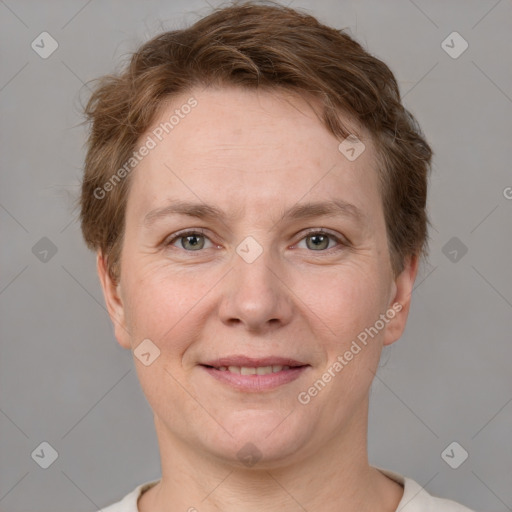 Joyful white adult female with short  brown hair and grey eyes