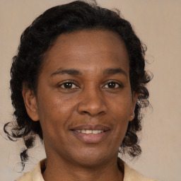 Joyful black adult female with medium  brown hair and brown eyes