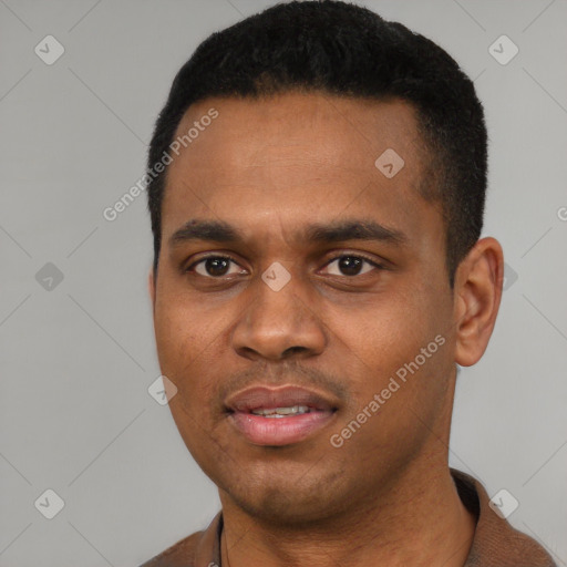 Joyful black young-adult male with short  black hair and brown eyes