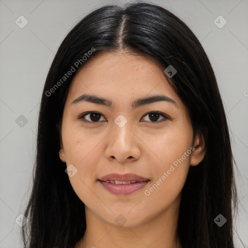 Joyful latino young-adult female with long  black hair and brown eyes