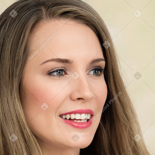 Joyful white young-adult female with long  brown hair and green eyes