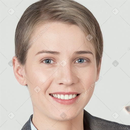 Joyful white young-adult female with short  brown hair and grey eyes