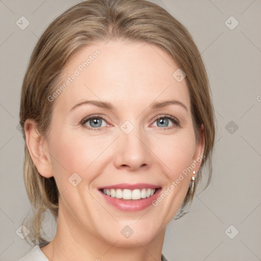 Joyful white adult female with medium  brown hair and grey eyes