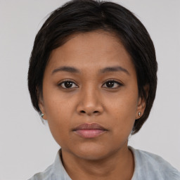 Neutral asian young-adult female with short  brown hair and brown eyes