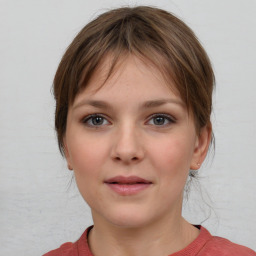 Neutral white young-adult female with medium  brown hair and grey eyes