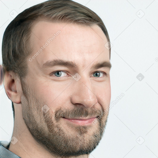 Joyful white adult male with short  brown hair and blue eyes