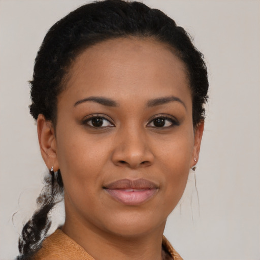 Joyful black young-adult female with short  brown hair and brown eyes