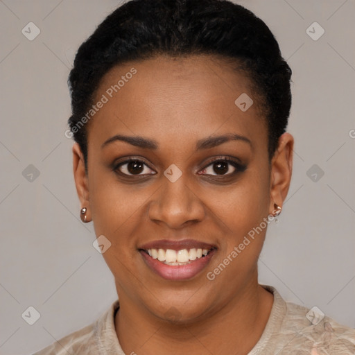 Joyful black young-adult female with short  black hair and brown eyes