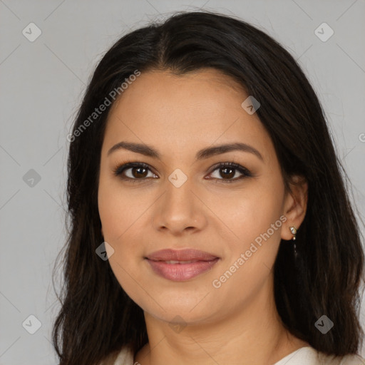 Joyful latino young-adult female with long  brown hair and brown eyes