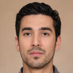 Neutral white young-adult male with short  black hair and brown eyes